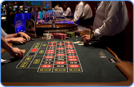 Players and croupier at the American roulette table