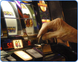 Player insert coin into the traditional slot machine