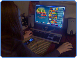 Woman playing Power Cash scratch card game